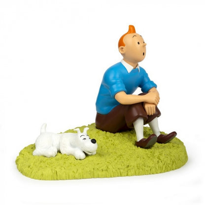 Tintin sitting in the grass. Official Tintin statue made by Moulinsart. New 2023!